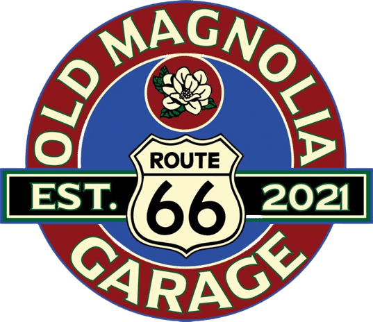 Old Magnolia Garage Route 66 logo featuring a magnolia flower, vintage highway sign, and "Established 2021" text in a retro red, white, and blue color scheme.